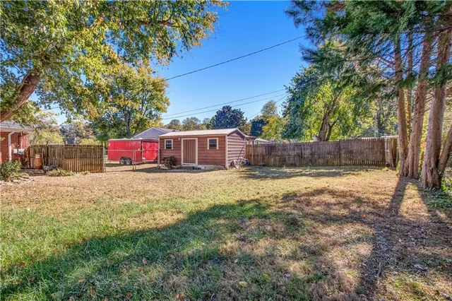 a fire hydrant in front of a yard