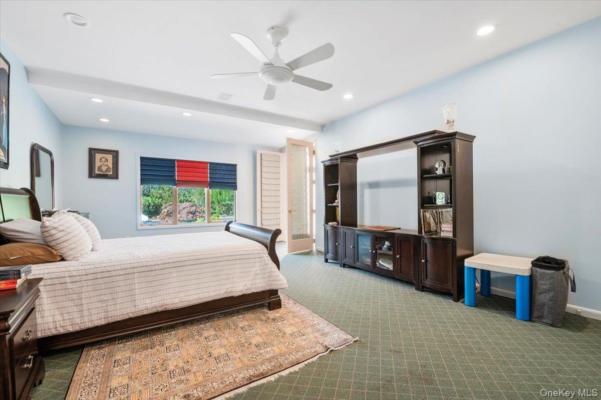 12 Ridge Court Glen Head, NY 11545 - Photo 17 of 46 Carpeted bedroom featuring recessed lighting and a ceiling fan