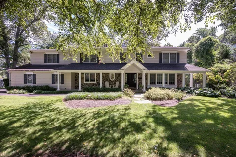 a front view of a house with yard porch and livingroom