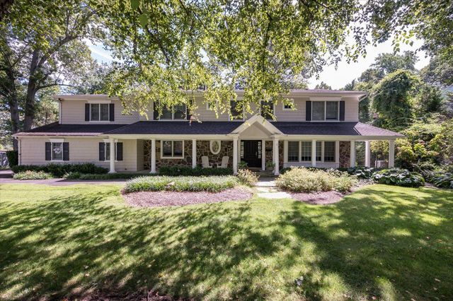 a front view of a house with yard porch and livingroom