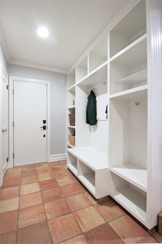 a view of an entryway with wooden floors