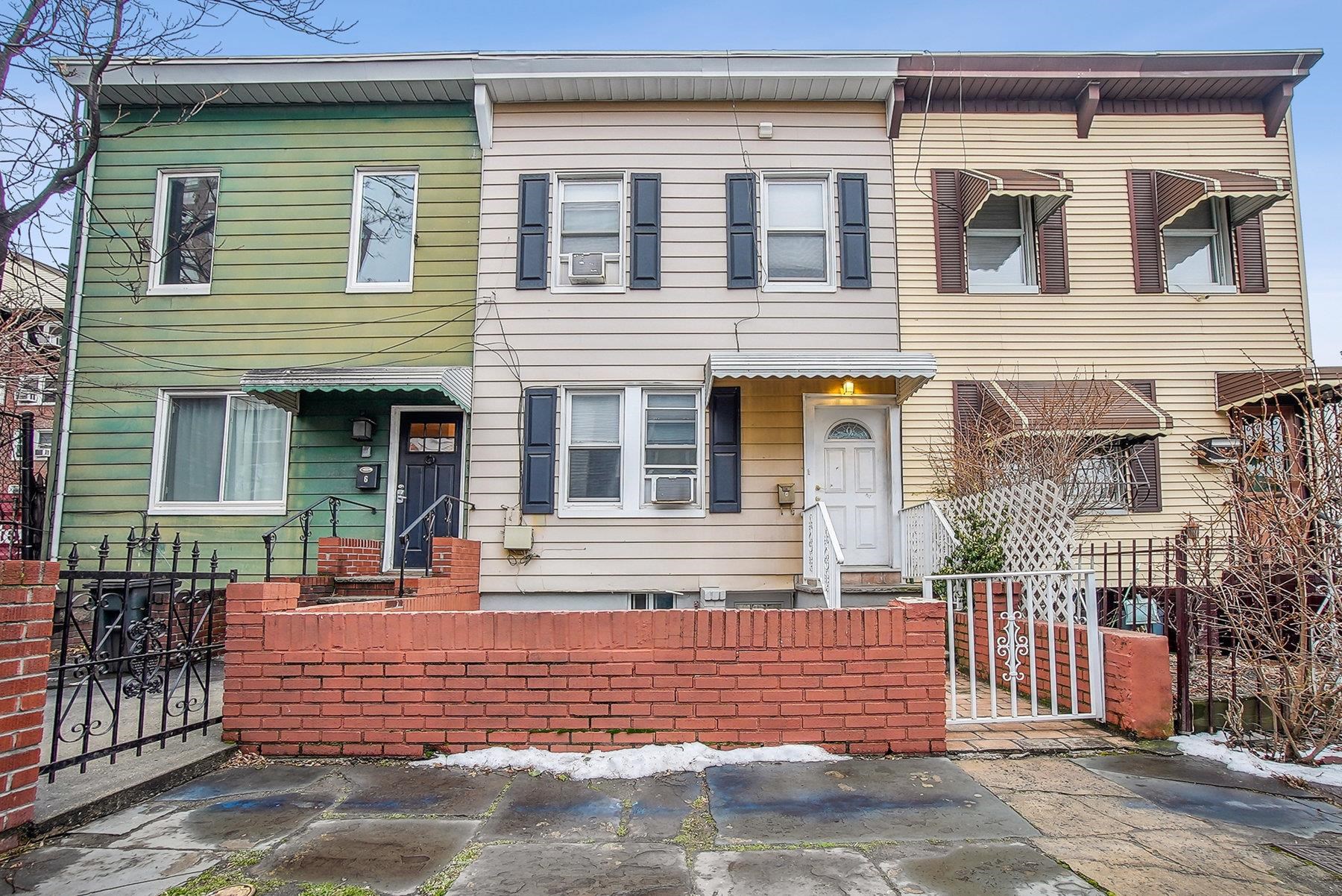 4 Rademan Place Jersey City, NJ 07310 - Photo 1 of 16 front view of a house with a door