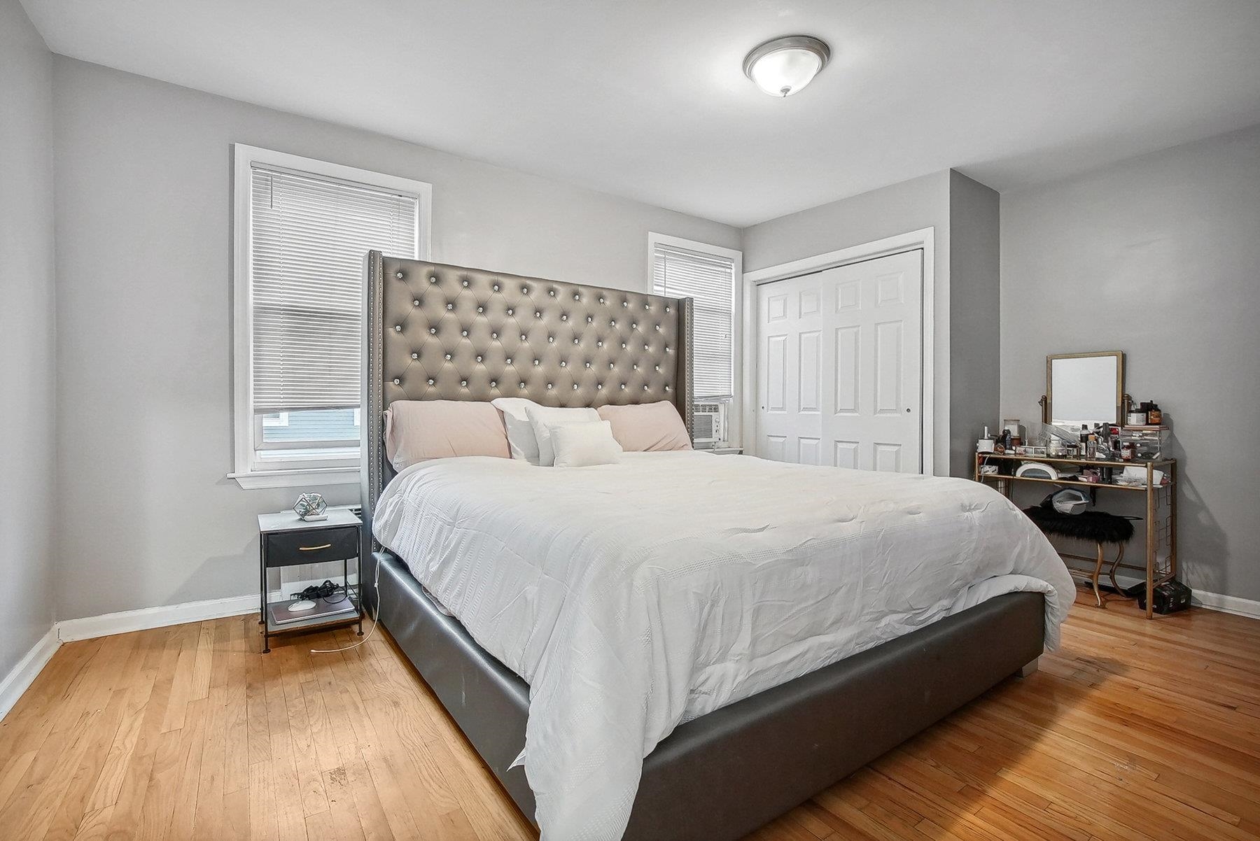 4 Rademan Place Jersey City, NJ 07310 - Photo 3 of 16 a bedroom with a bed and a night stand
