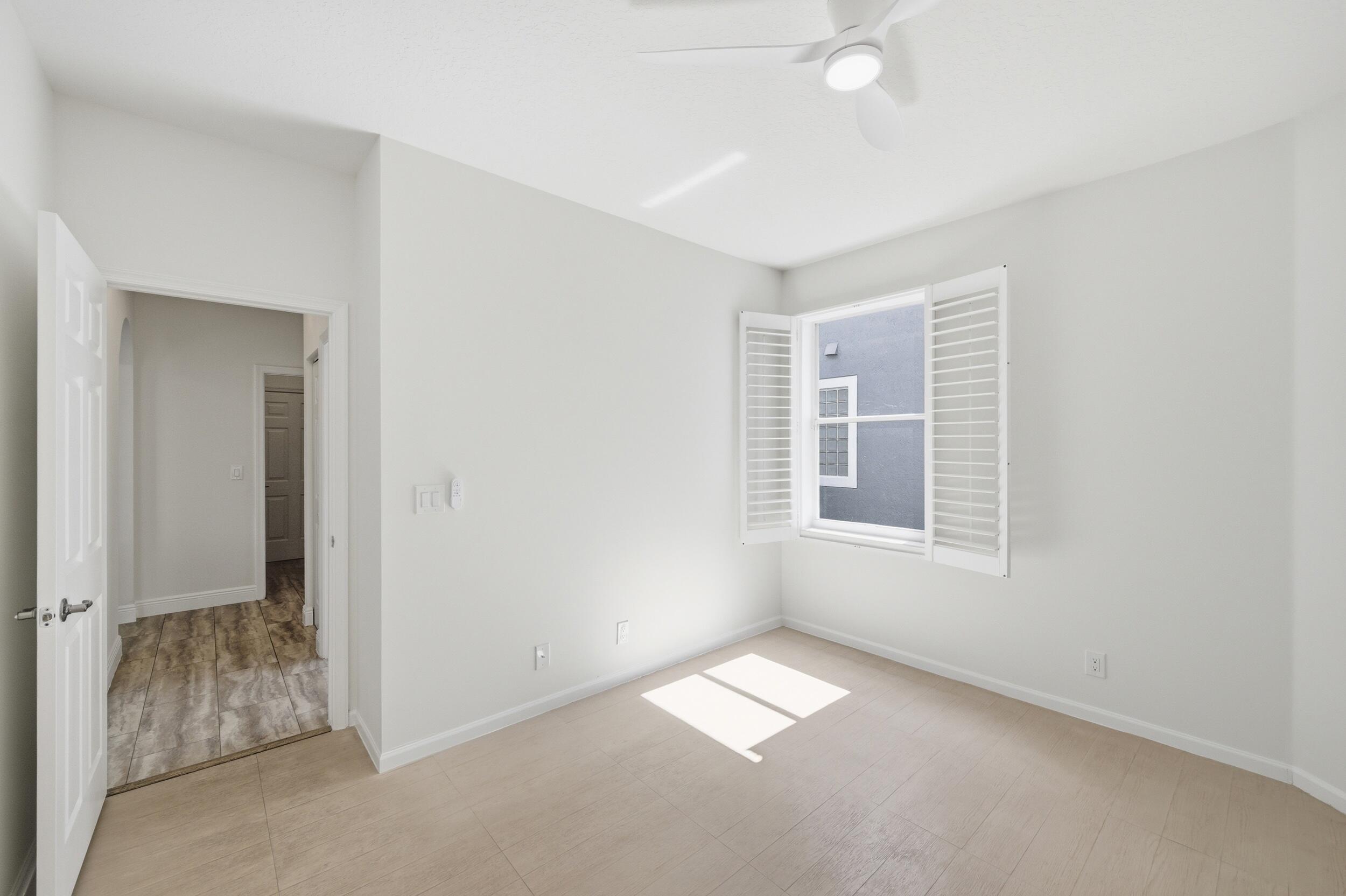 8534 Vía D Oro Boca Raton, FL 33433 - Photo 28 of 34 a view of empty room with windows