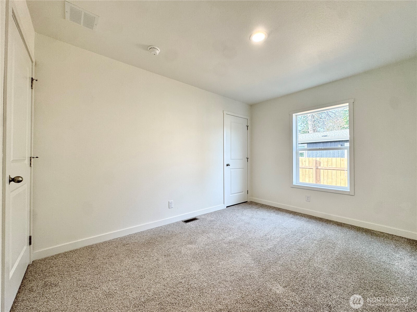 3060 Pennsylvania Street Longview, WA 98632 - Photo 11 of 14 an empty room with a window