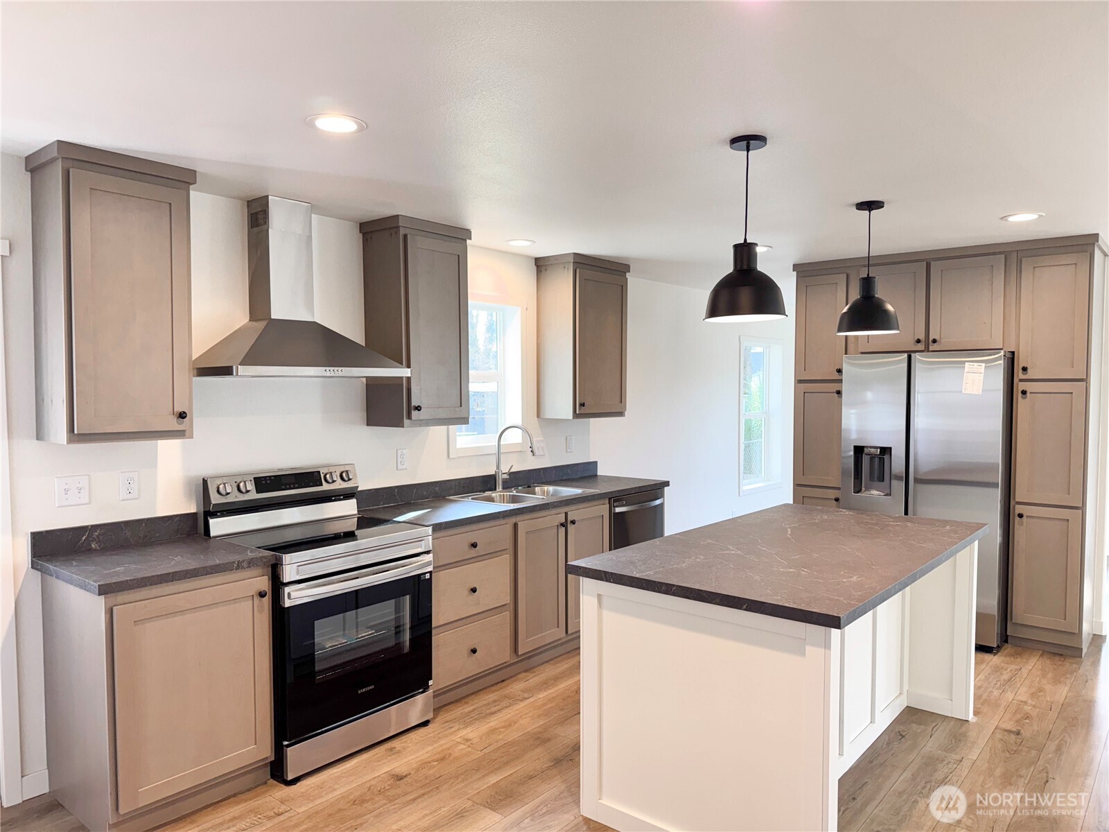 3060 Pennsylvania Street Longview, WA 98632 - Photo 6 of 14 a kitchen with stainless steel appliances granite countertop a sink stove and refrigerator