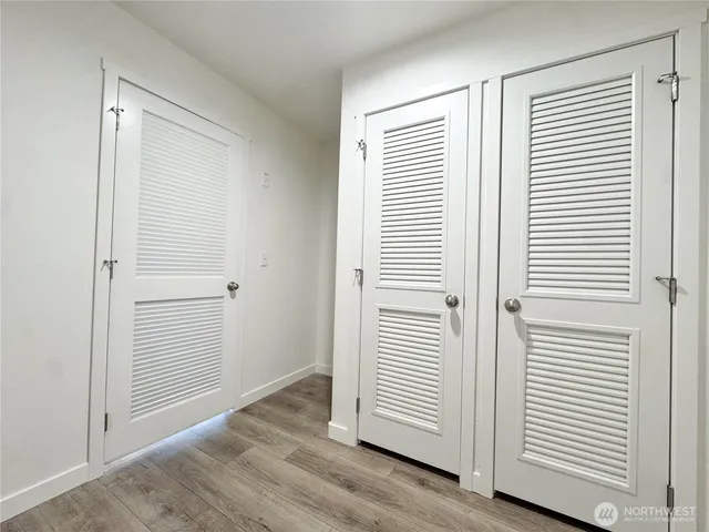 an empty room with wooden floor