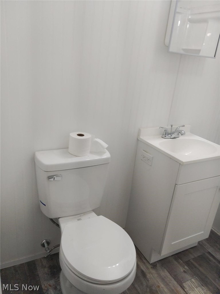 3995 Clay Pike Road Cambridge, OH 43725 - Photo 6 of 10 Bathroom featuring dark wood-style flooring and vanity