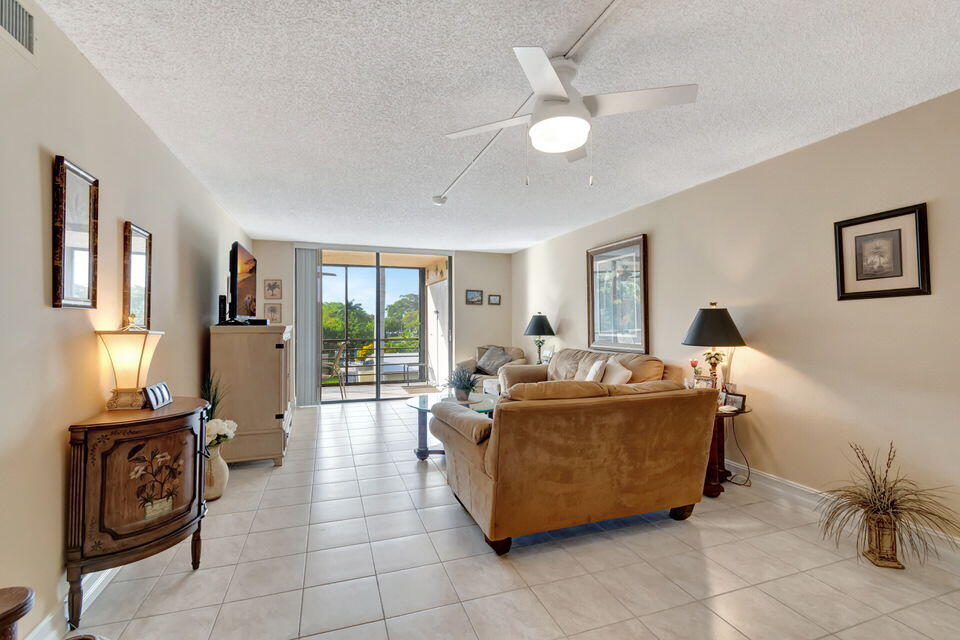 555 Banyan Tree Lane, Unit 302 Delray Beach, FL 33483 - Photo 39 of 69 a living room with furniture and a window
