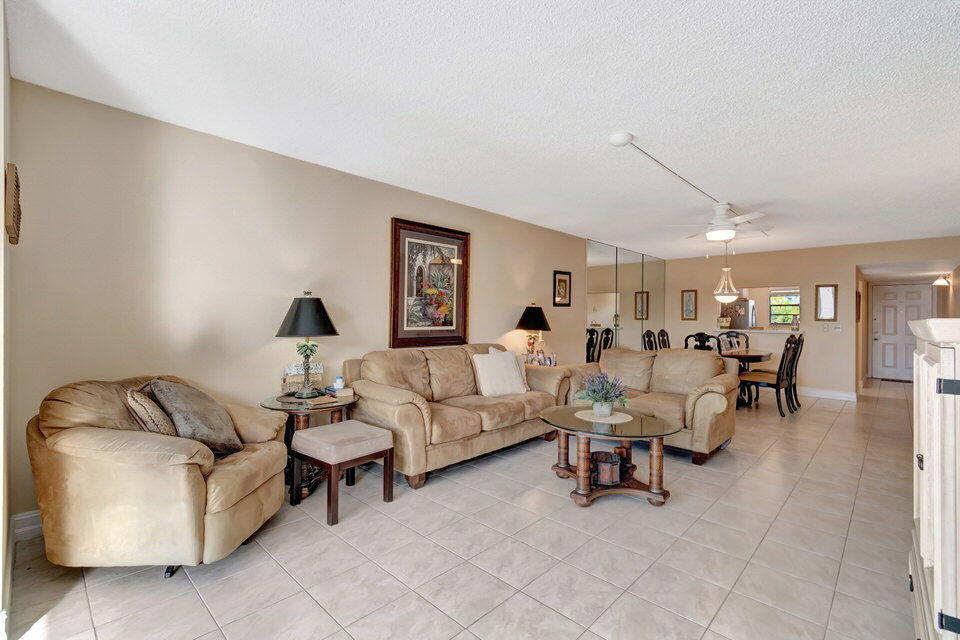 555 Banyan Tree Lane, Unit 302 Delray Beach, FL 33483 - Photo 43 of 69 a living room with furniture and a window