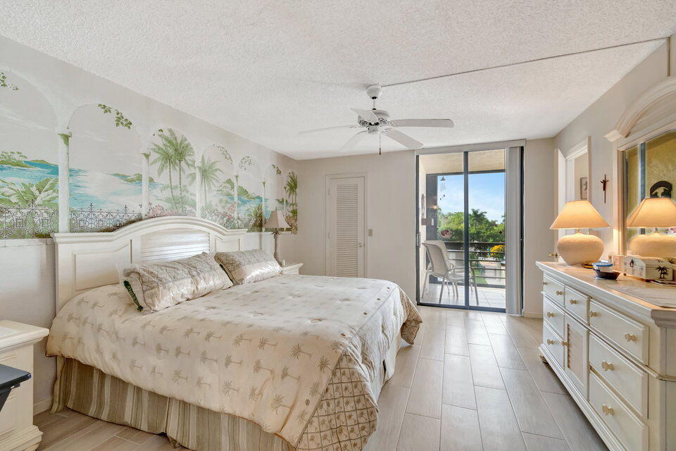 555 Banyan Tree Lane, Unit 302 Delray Beach, FL 33483 - Photo 52 of 69 a bedroom with a large bed and a view of bedroom