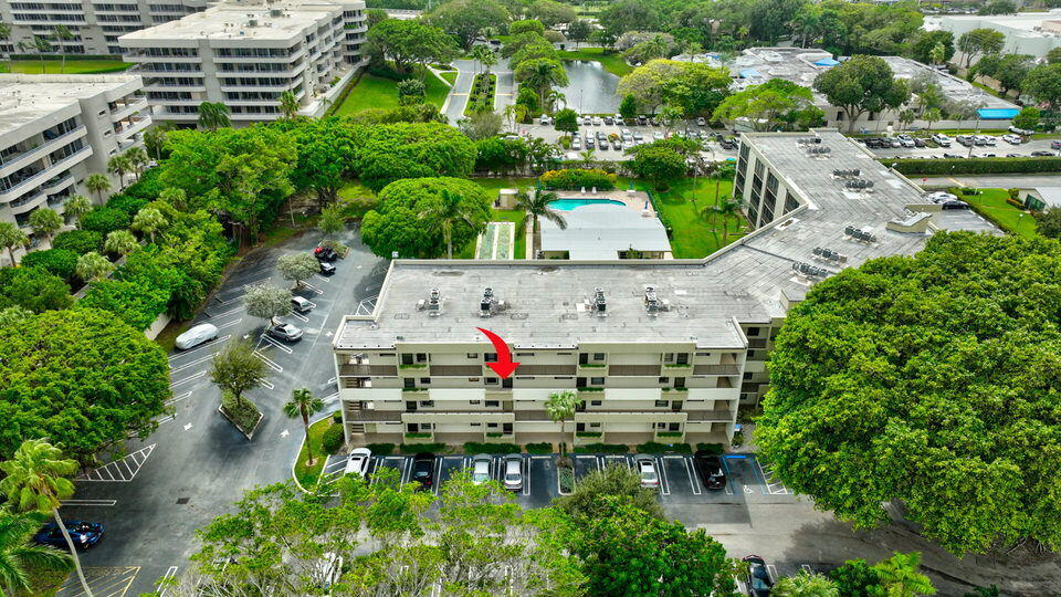 555 Banyan Tree Lane, Unit 302 Delray Beach, FL 33483 - Photo 63 of 69 an aerial view of house with yard swimming pool and outdoor seating