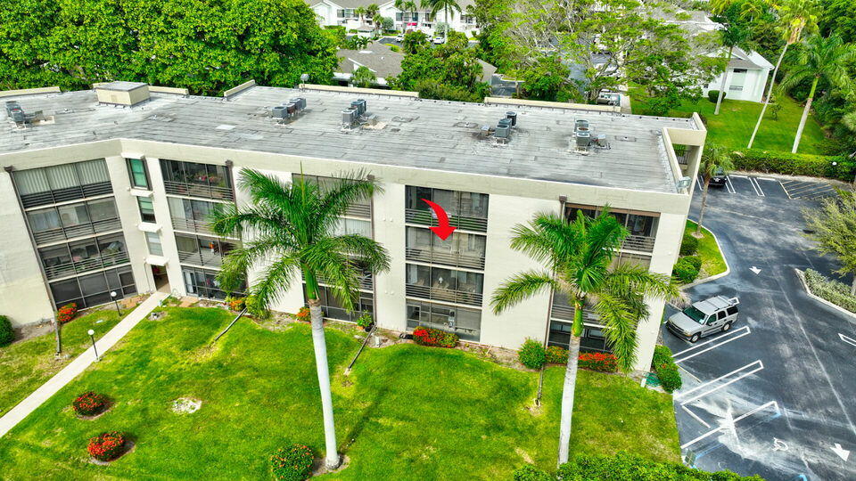 555 Banyan Tree Lane, Unit 302 Delray Beach, FL 33483 - Photo 67 of 69 a view of an house with backyard space and garden