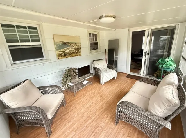 a living room with furniture and a window