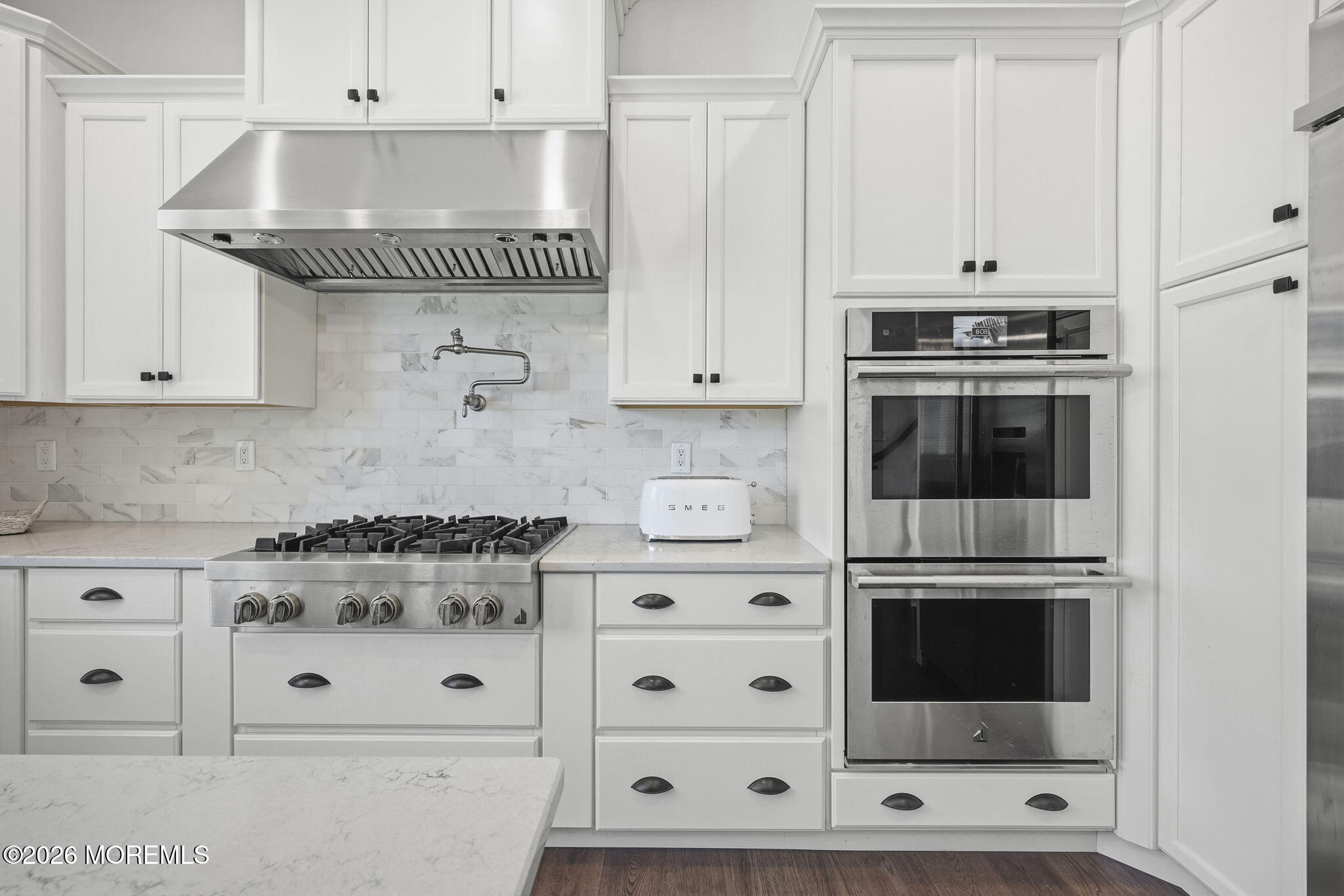 66 Windermere Road Lincroft, NJ 07738 - Photo 11 of 48 a kitchen with granite countertop white cabinets and a stove