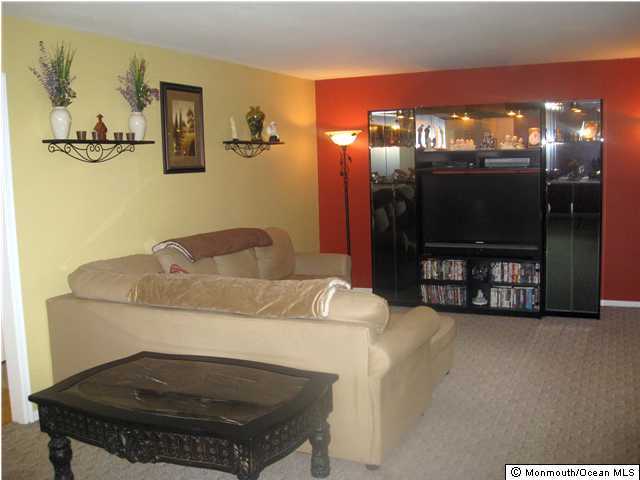 45 Frank Applegate Road Jackson, NJ 08527 - Photo 2 of 3 a living room with furniture and a flat screen tv