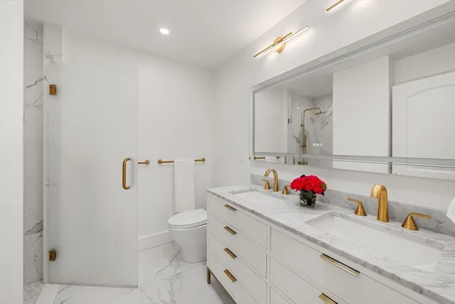 a bedroom with a bed and a television