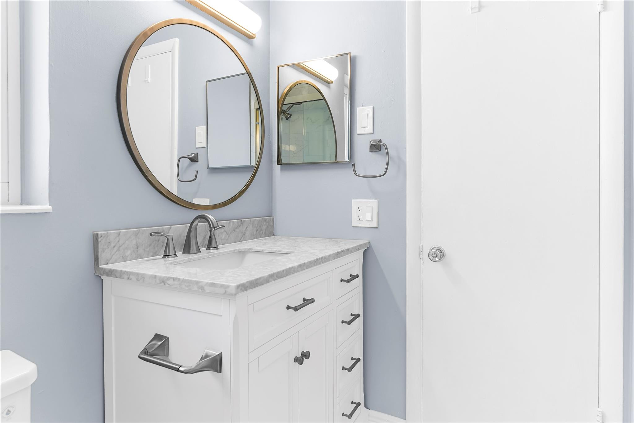4751 Northeast 21st Terrace, Unit 3 Lighthouse Point, FL 33064 - Photo 11 of 18 a bathroom with a sink and a mirror