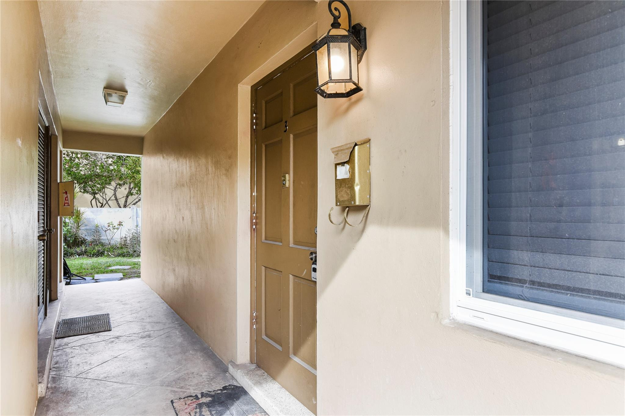 4751 Northeast 21st Terrace, Unit 3 Lighthouse Point, FL 33064 - Photo 17 of 18 a view of a hallway with a outdoor space