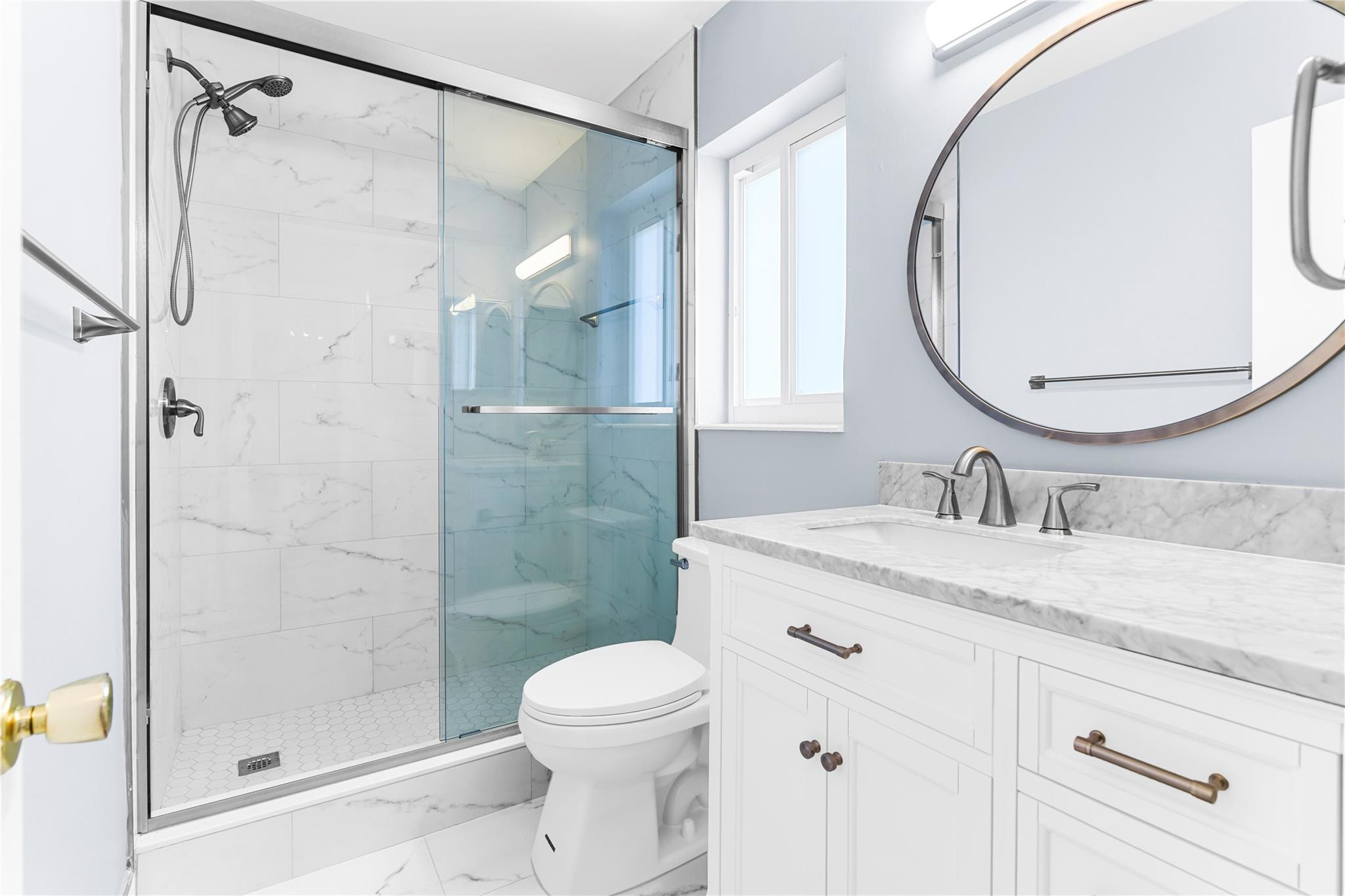 4751 Northeast 21st Terrace, Unit 3 Lighthouse Point, FL 33064 - Photo 10 of 18 a bathroom with a granite countertop sink toilet and shower