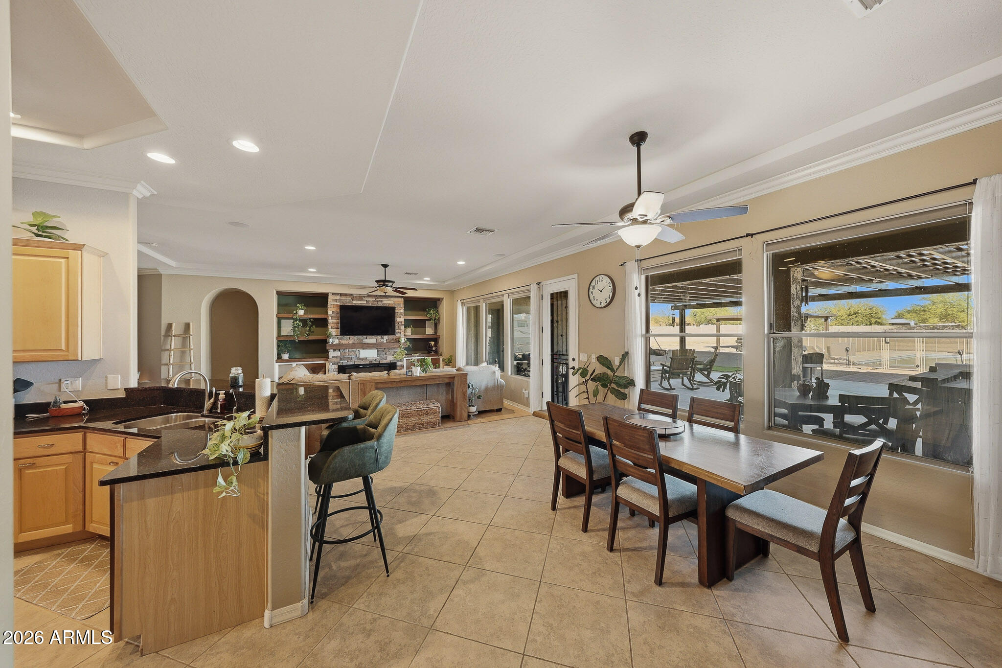 23024 West Sierra Ridge Way Wittmann, AZ 85361 - Photo 37 of 99 a view of a dining room with furniture window and outside view