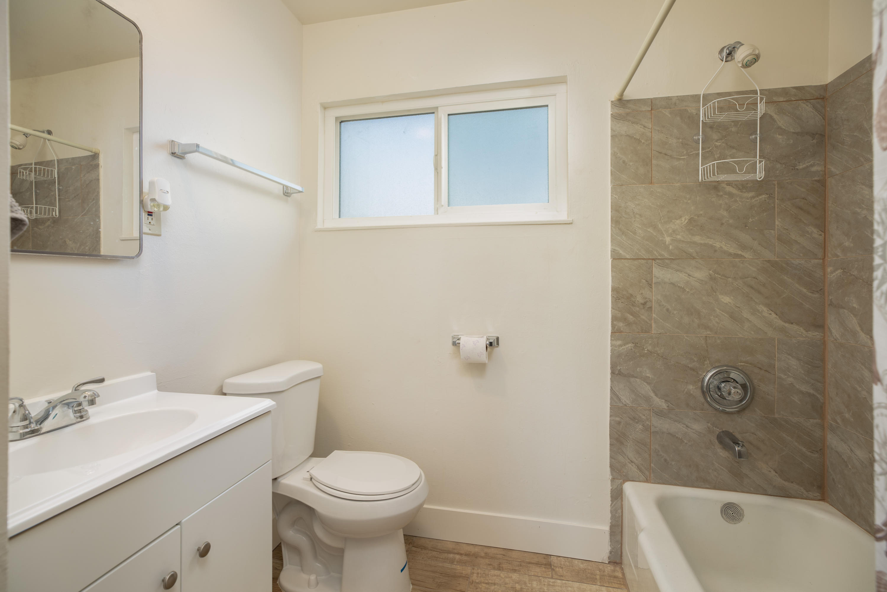 248 North Norma Street Ridgecrest, CA 93555 - Photo 9 of 17 a bathroom with a sink toilet and shower