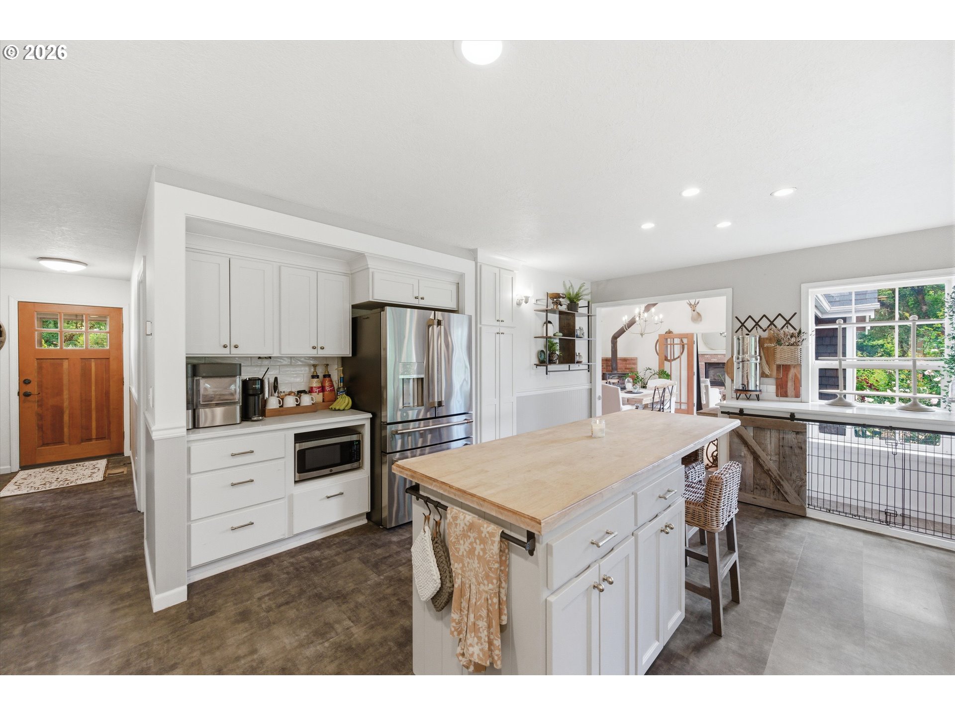 13880 McCaleb Road Monmouth, OR 97361 - Photo 13 of 44 a kitchen that has a lot of cabinets a sink and appliances in it