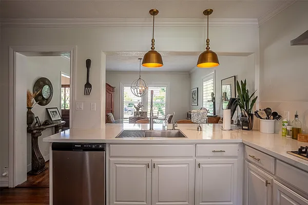 a kitchen with sink and cabinets