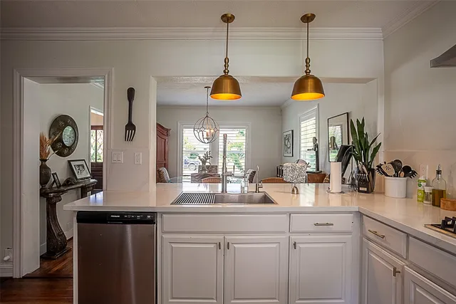 a kitchen with sink and cabinets
