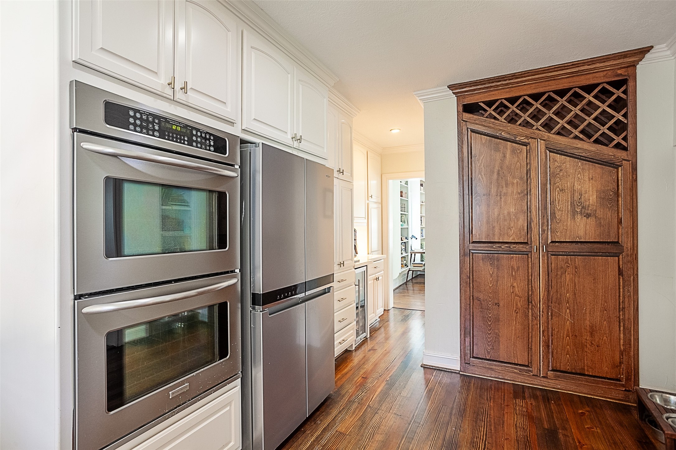 260 Manor Street Beaumont, TX 77706 - Photo 18 of 50 a kitchen with granite countertop stainless steel appliances a counter space and wooden floor