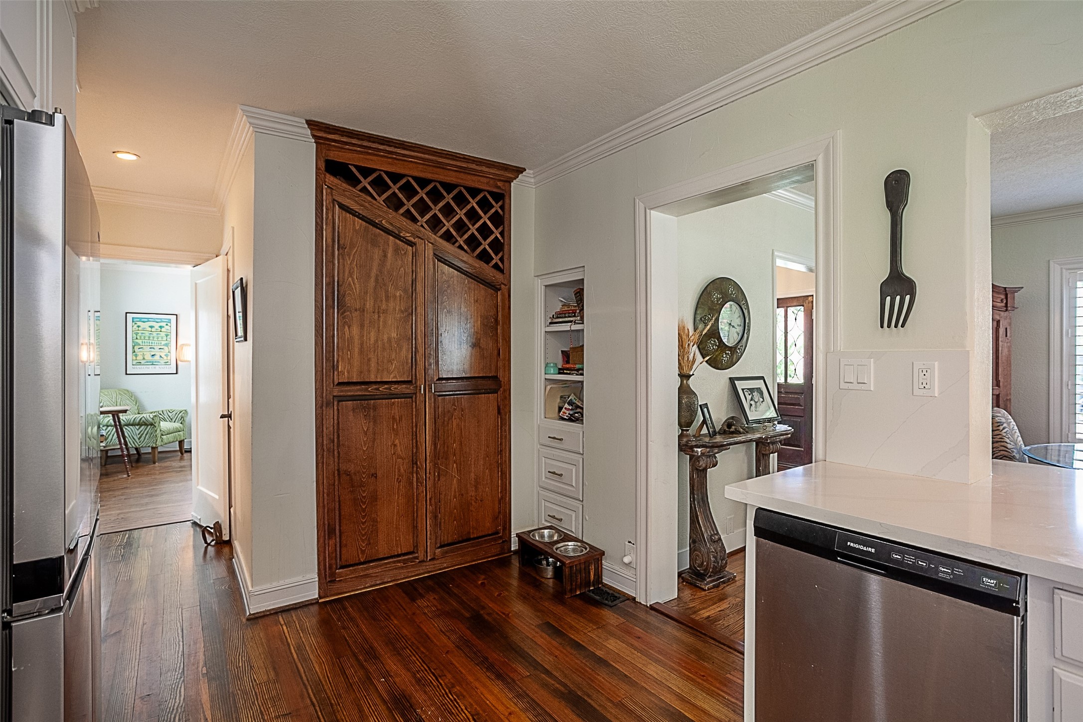 260 Manor Street Beaumont, TX 77706 - Photo 20 of 50 a view of a hallway with wooden floor and a living room