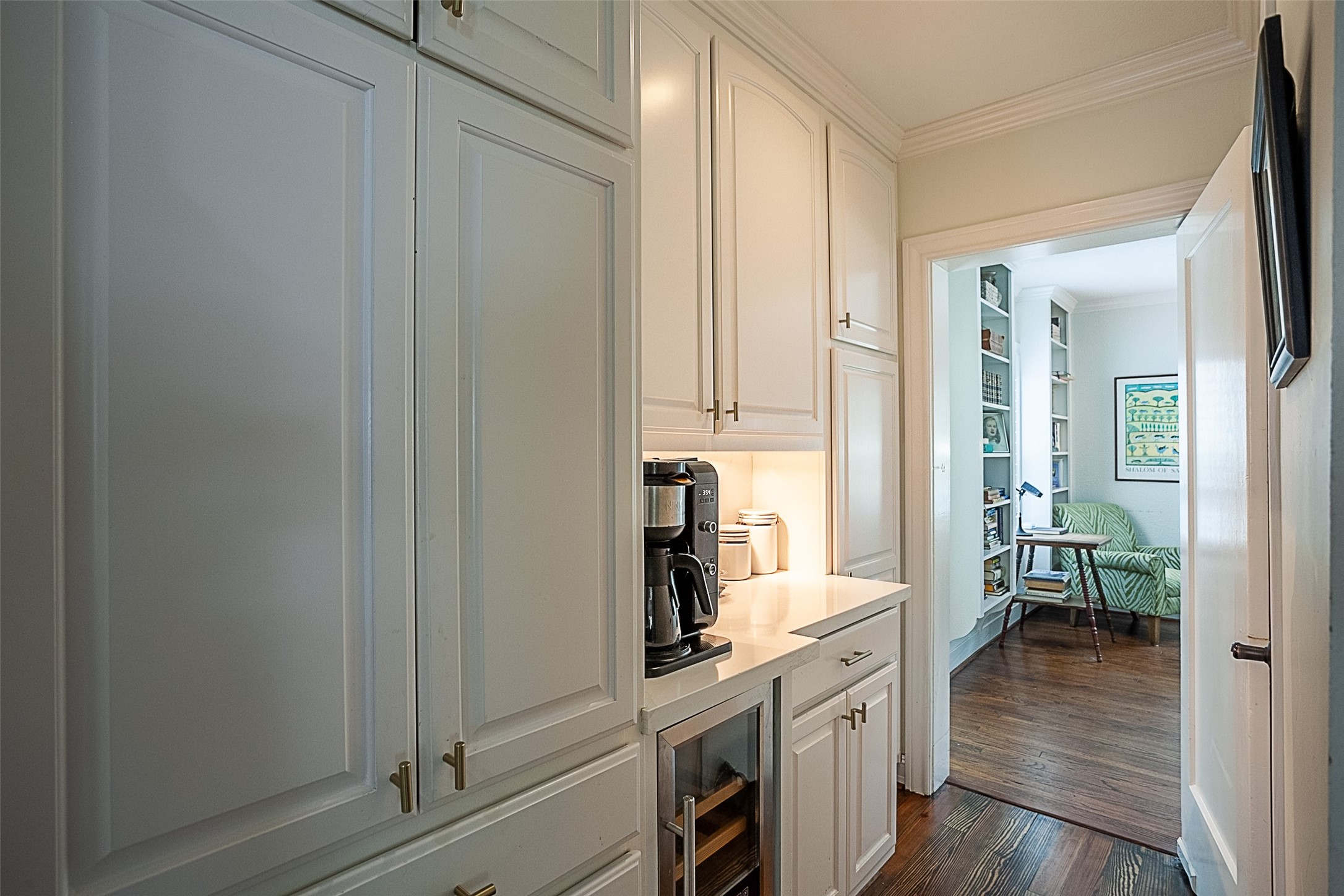 260 Manor Street Beaumont, TX 77706 - Photo 21 of 50 a kitchen with cabinets and wooden floor