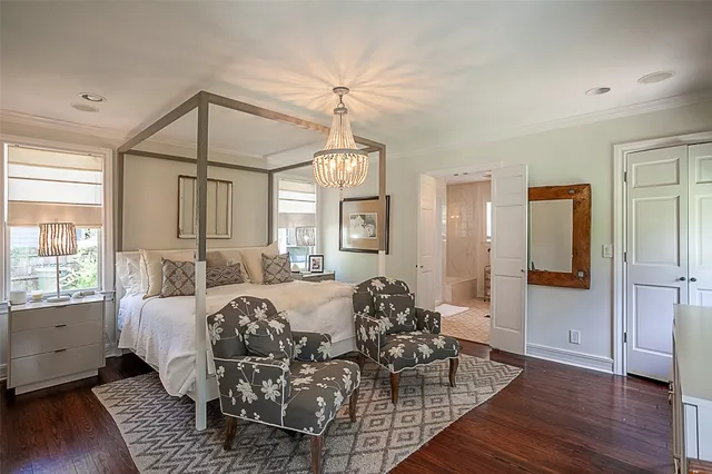 a view of a livingroom with furniture window and wooden floor
