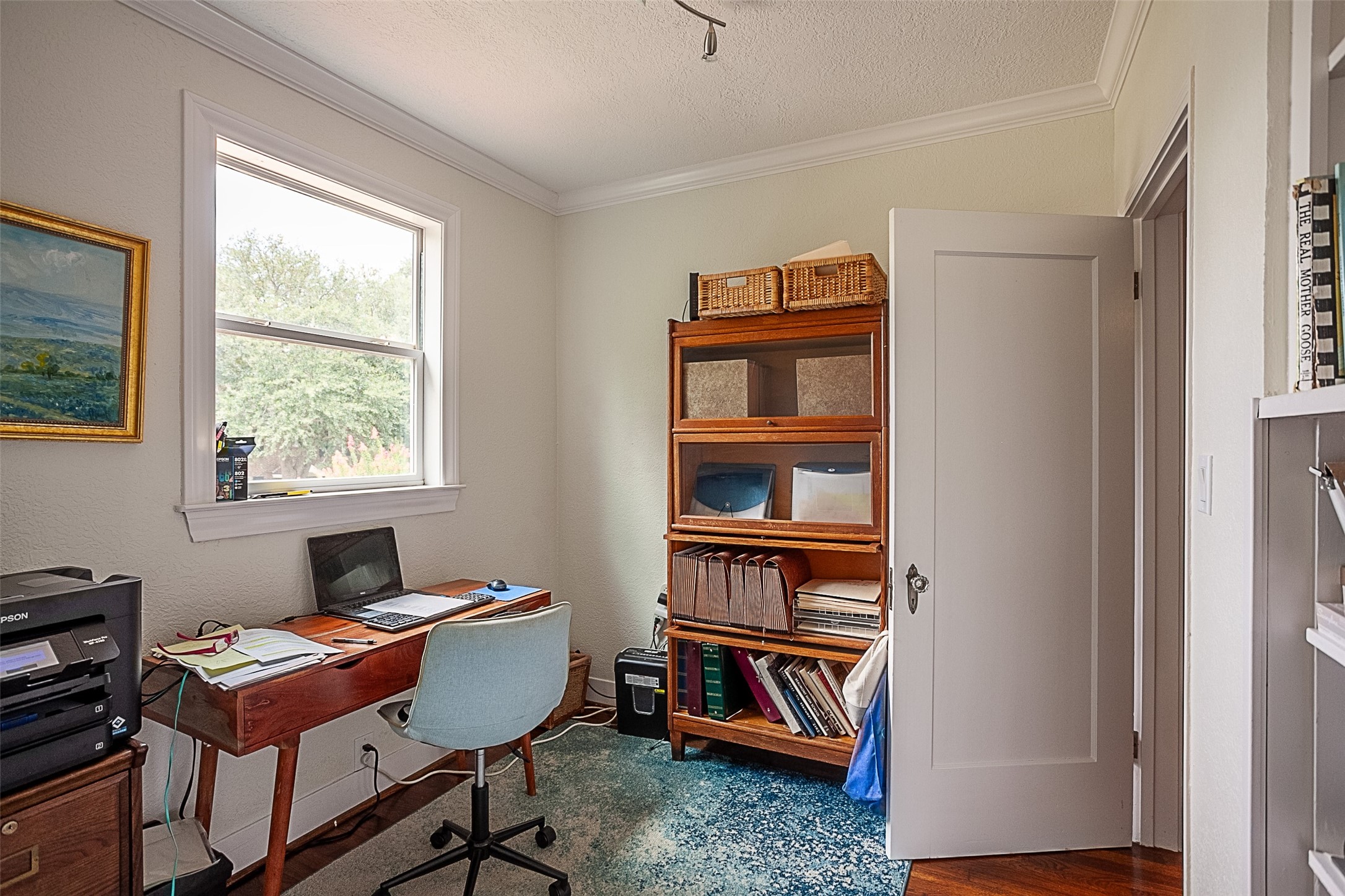 260 Manor Street Beaumont, TX 77706 - Photo 36 of 50 a view of a workspace with furniture and a window