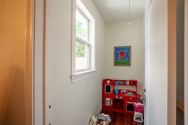 a bedroom with a bed and windows