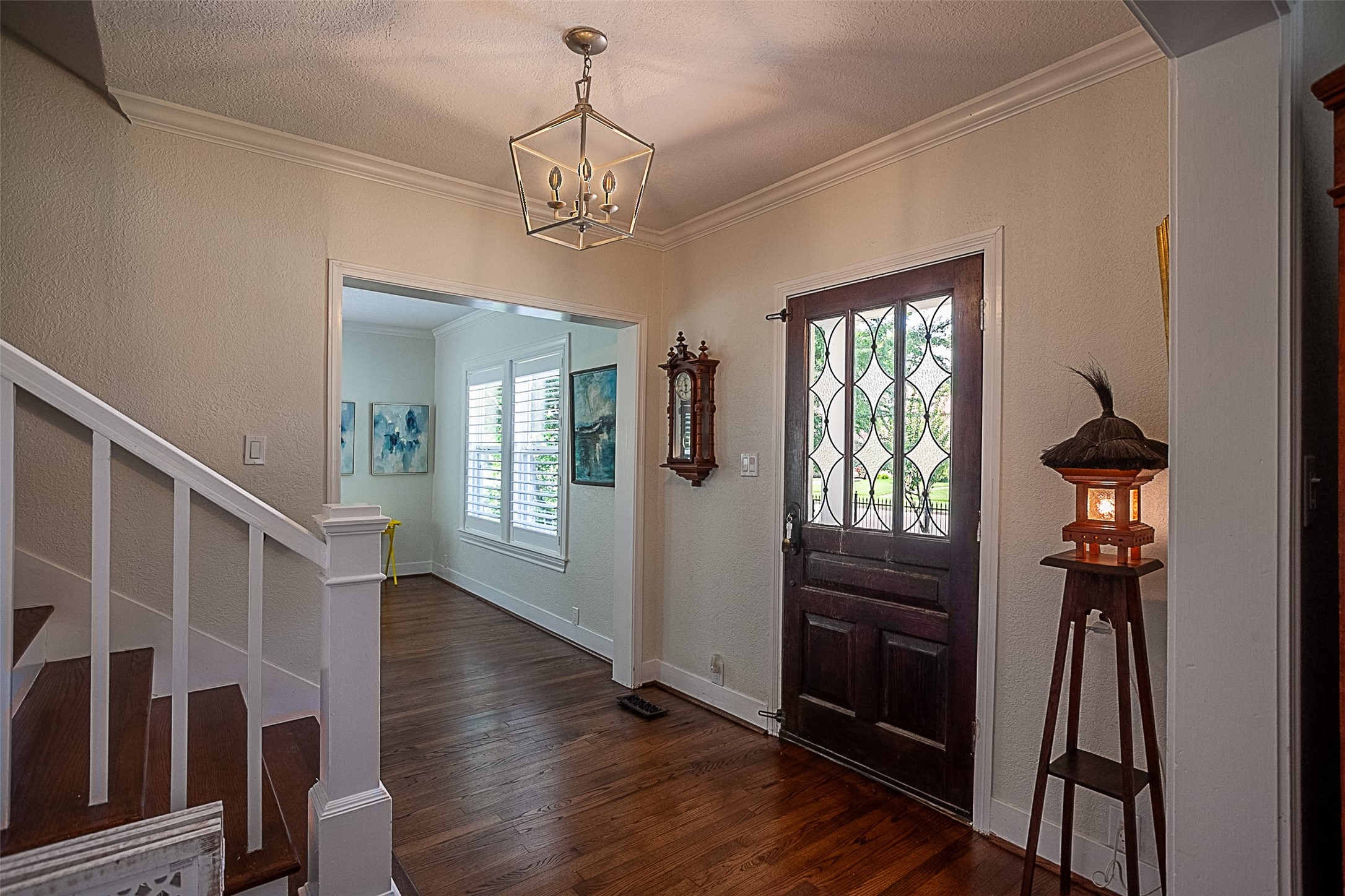 260 Manor Street Beaumont, TX 77706 - Photo 7 of 50 a view of a livingroom with wooden floor and stairs