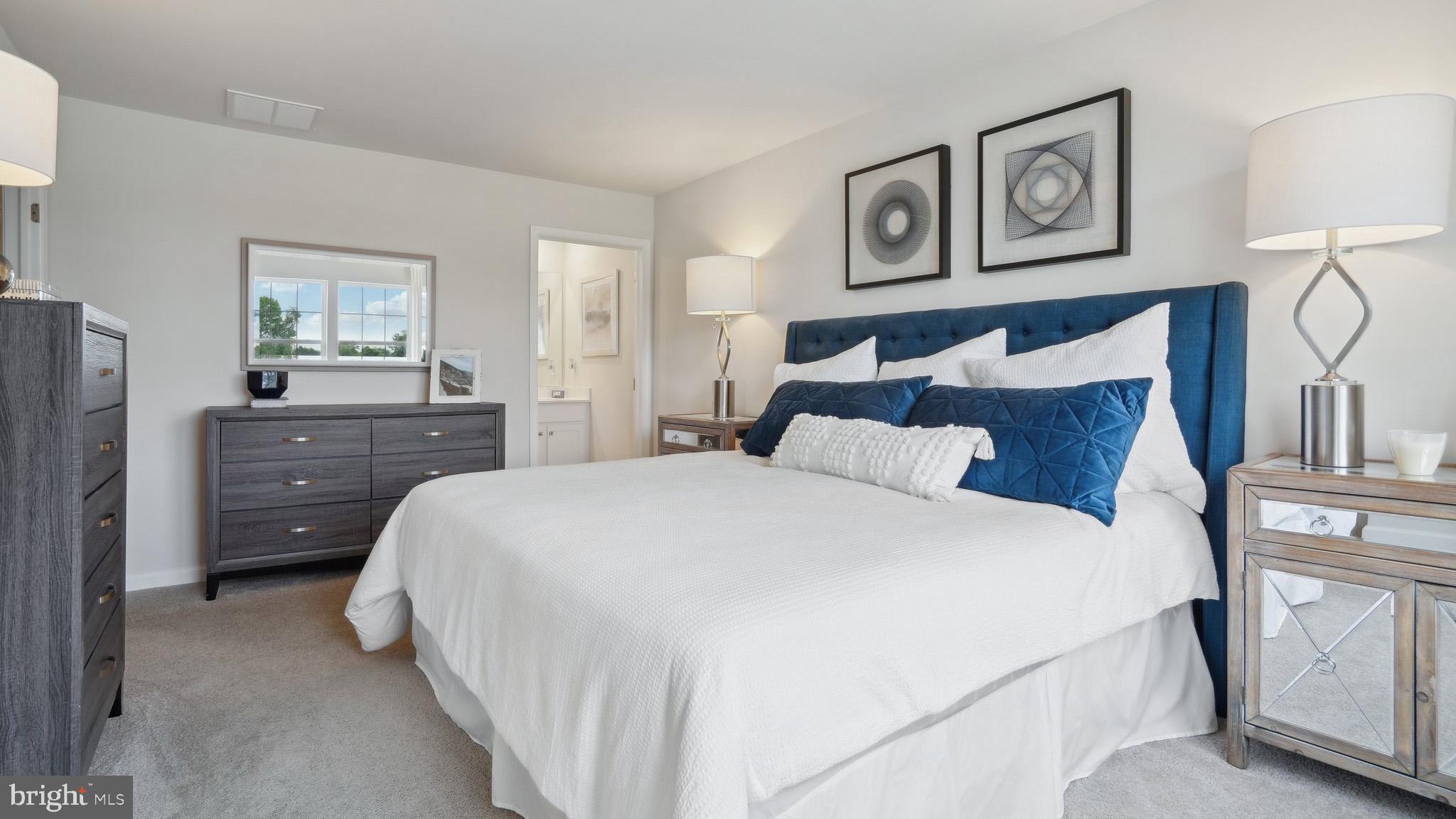 5 Eleanor Lane Roosevelt, NJ 08555 - Photo 14 of 25 a bedroom with a bed and painting on the wall