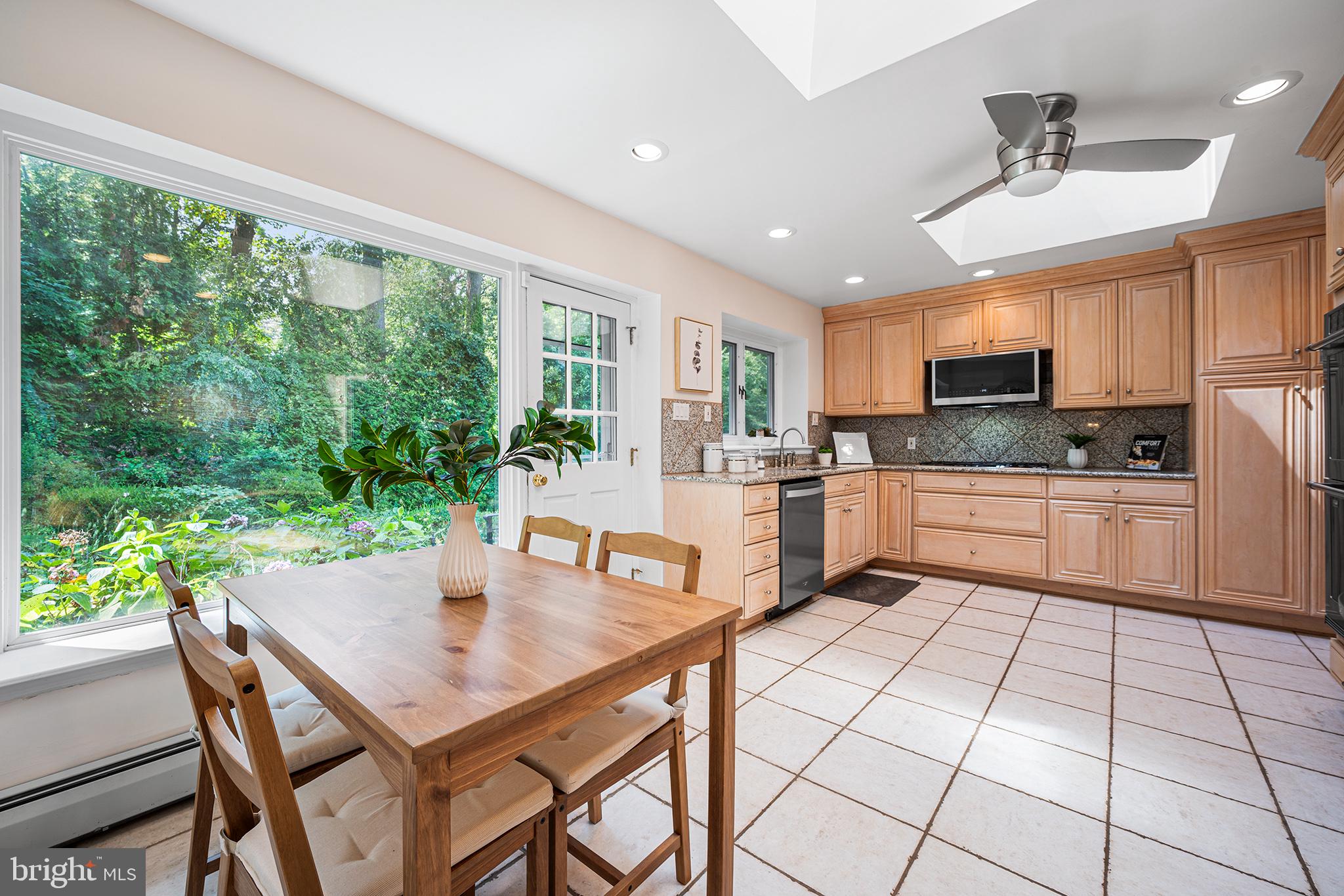 612 Manayunk Road Merion Station, PA 19066 - Photo 17 of 48 a kitchen with a table chairs microwave and cabinets