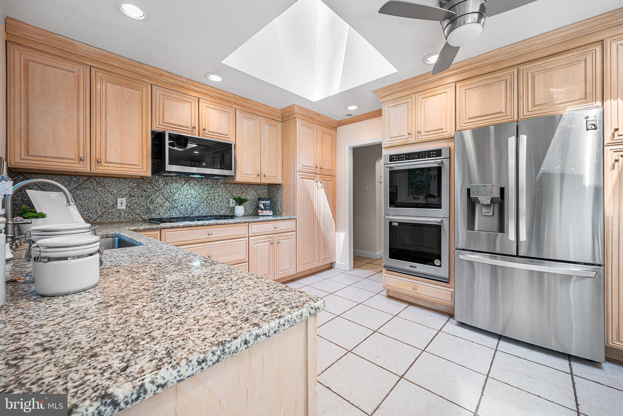612 Manayunk Road Merion Station, PA 19066 - Photo 18 of 48 a kitchen with stainless steel appliances granite countertop a refrigerator sink and stove