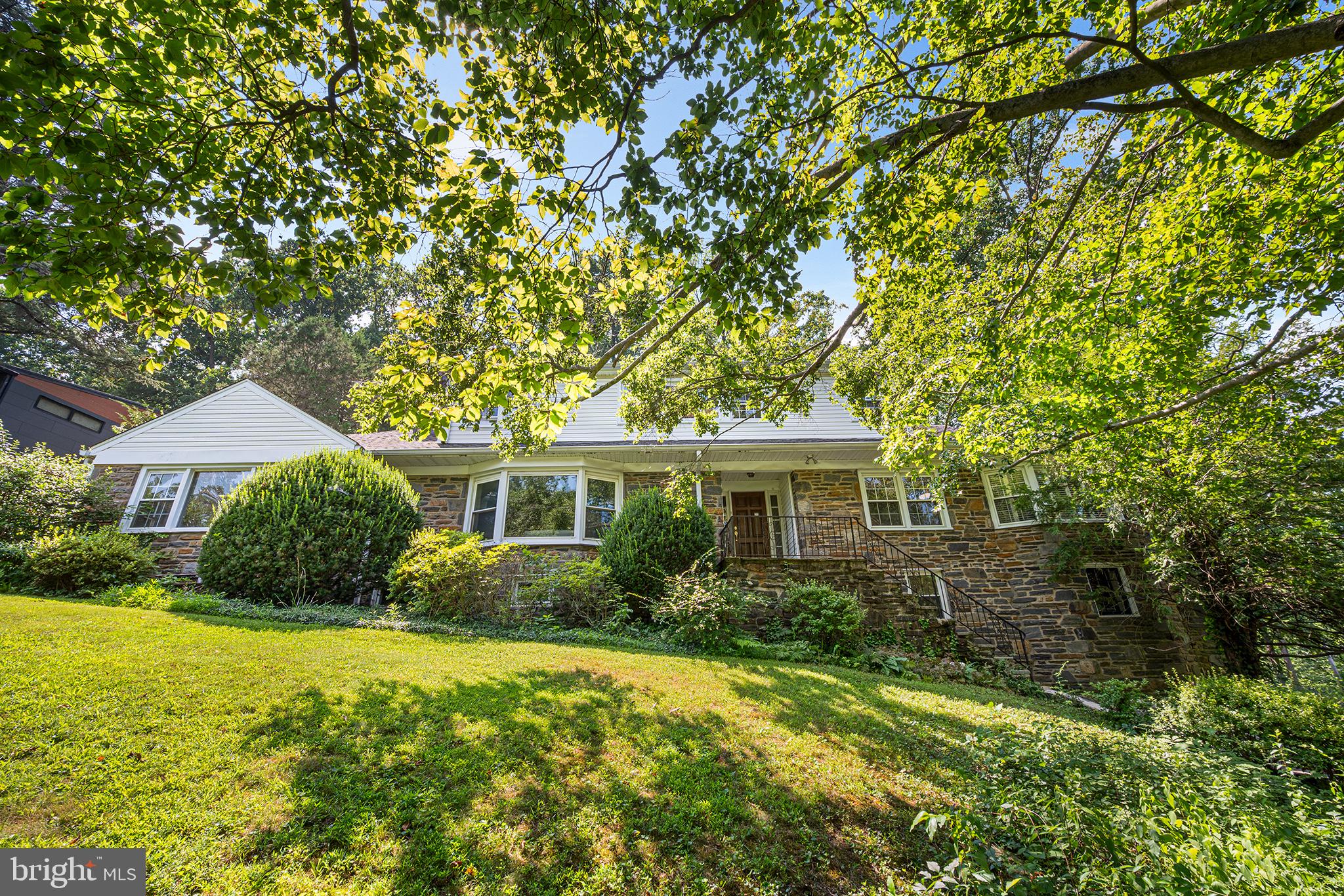 612 Manayunk Road Merion Station, PA 19066 - Photo 2 of 48 a front view of house with yard and green space