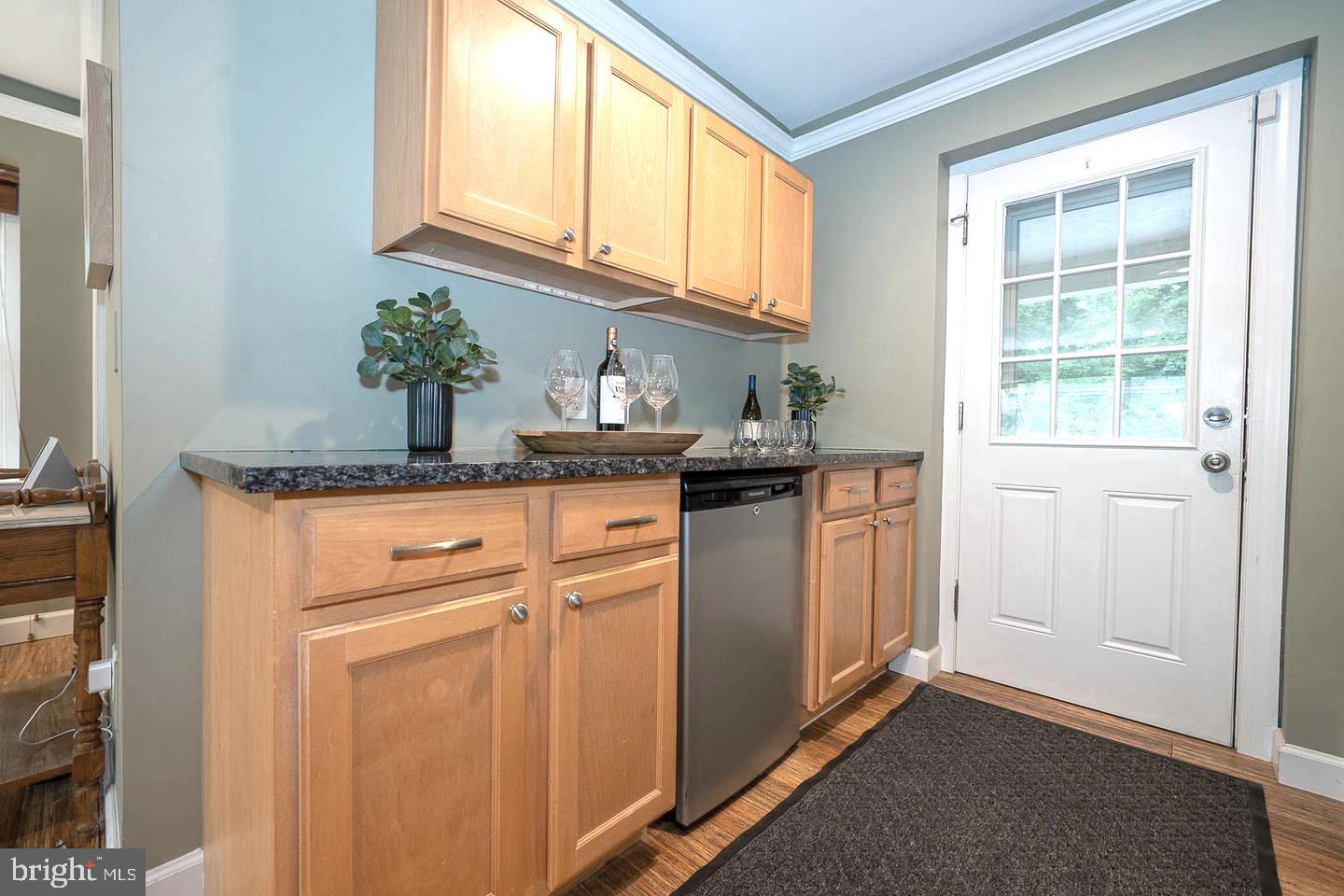 612 Manayunk Road Merion Station, PA 19066 - Photo 23 of 48 a kitchen with stainless steel appliances granite countertop a sink and a window