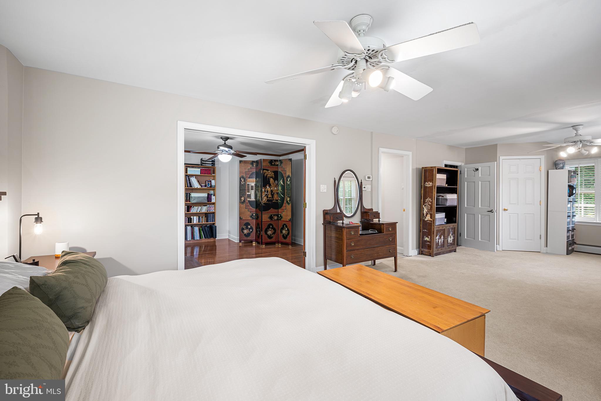 612 Manayunk Road Merion Station, PA 19066 - Photo 26 of 48 a bed room with a bed mirror and a chandelier
