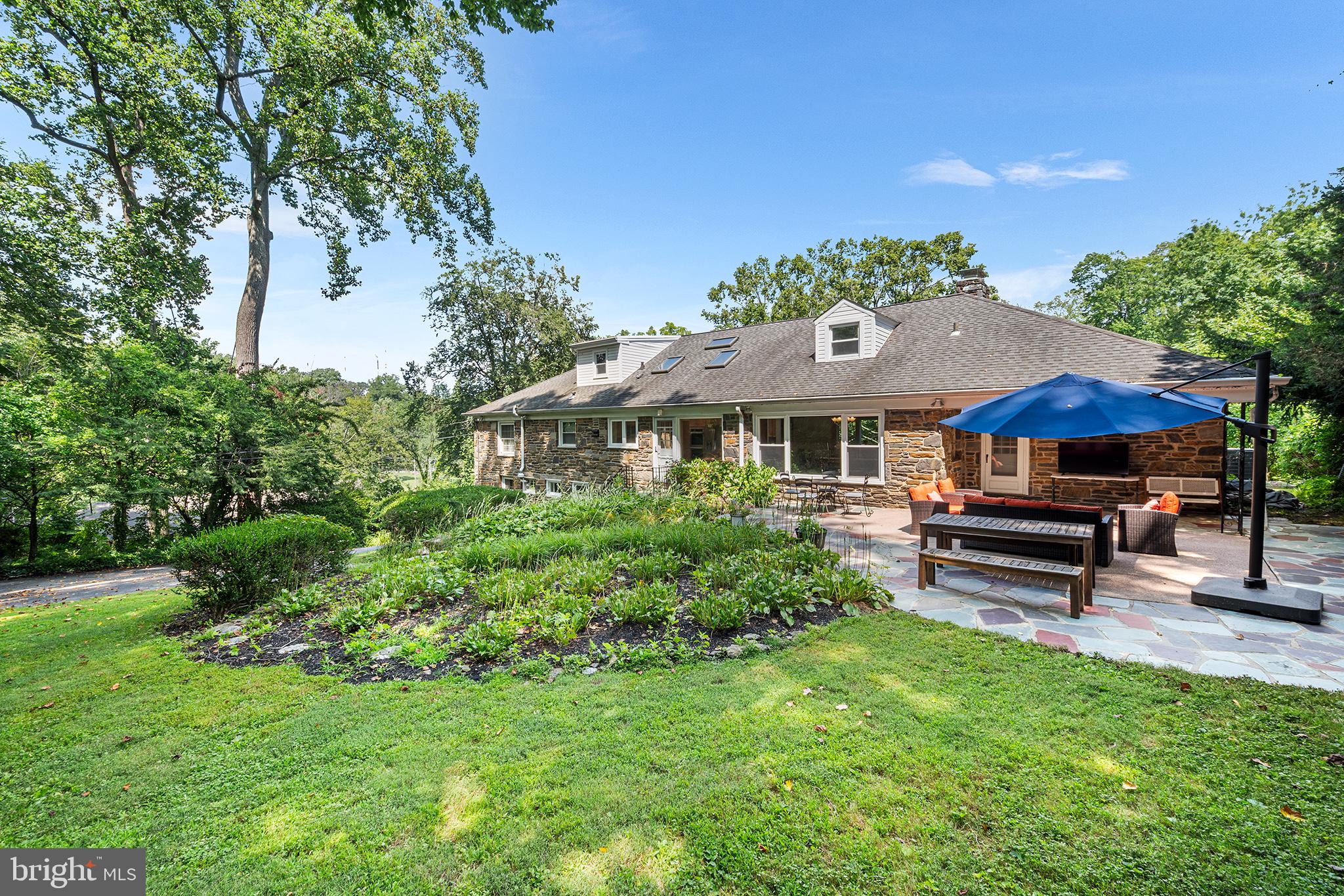 612 Manayunk Road Merion Station, PA 19066 - Photo 3 of 48 a front view of a house with a garden