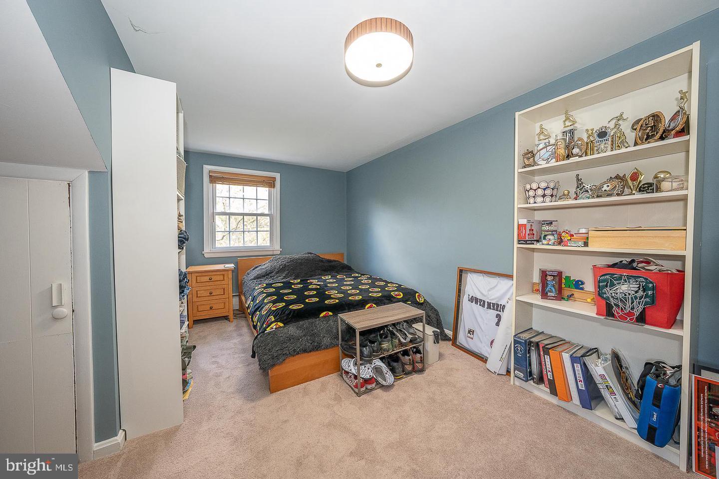612 Manayunk Road Merion Station, PA 19066 - Photo 31 of 48 a bedroom with furniture and a book shelf