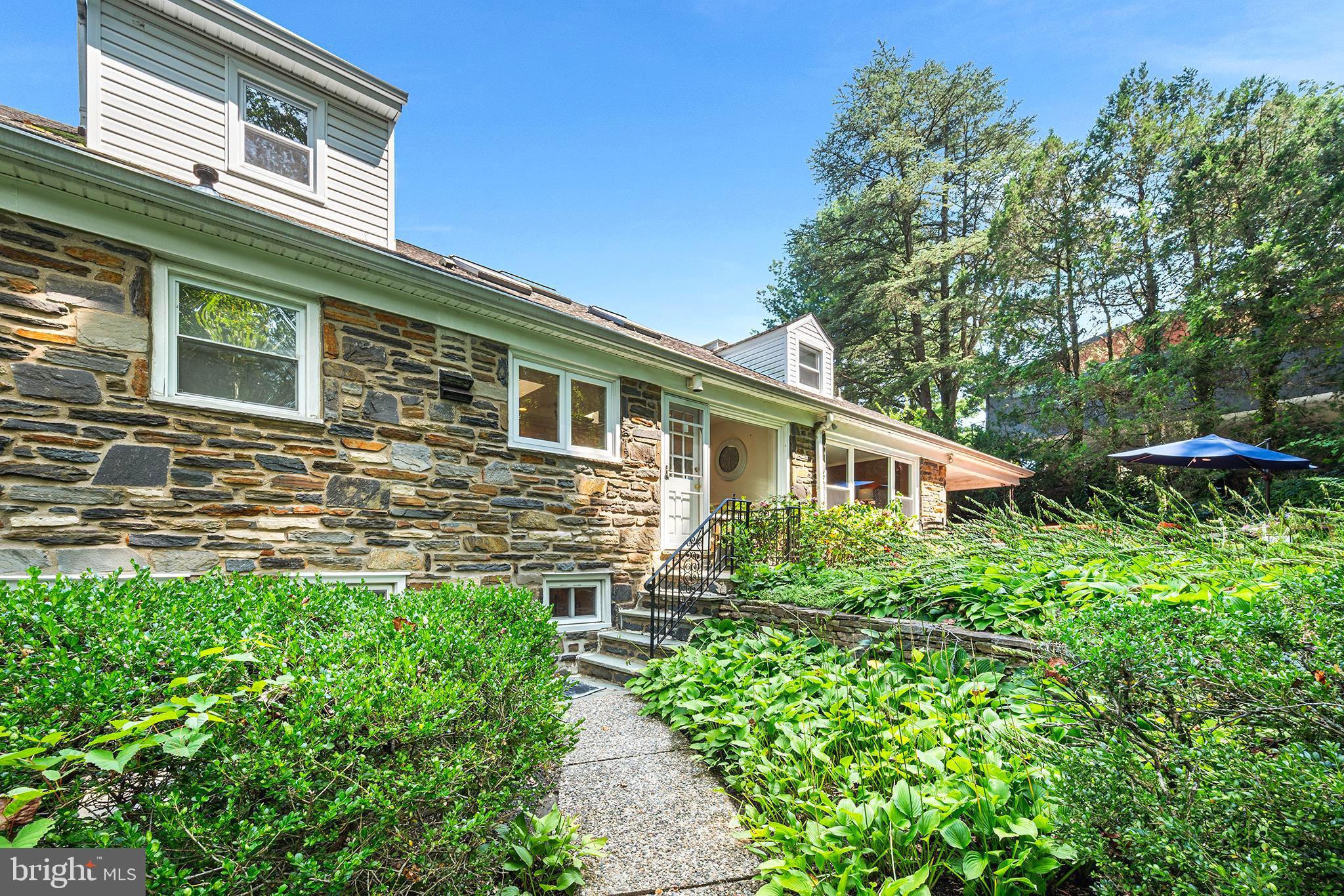 612 Manayunk Road Merion Station, PA 19066 - Photo 45 of 48 a front view of a house with plants