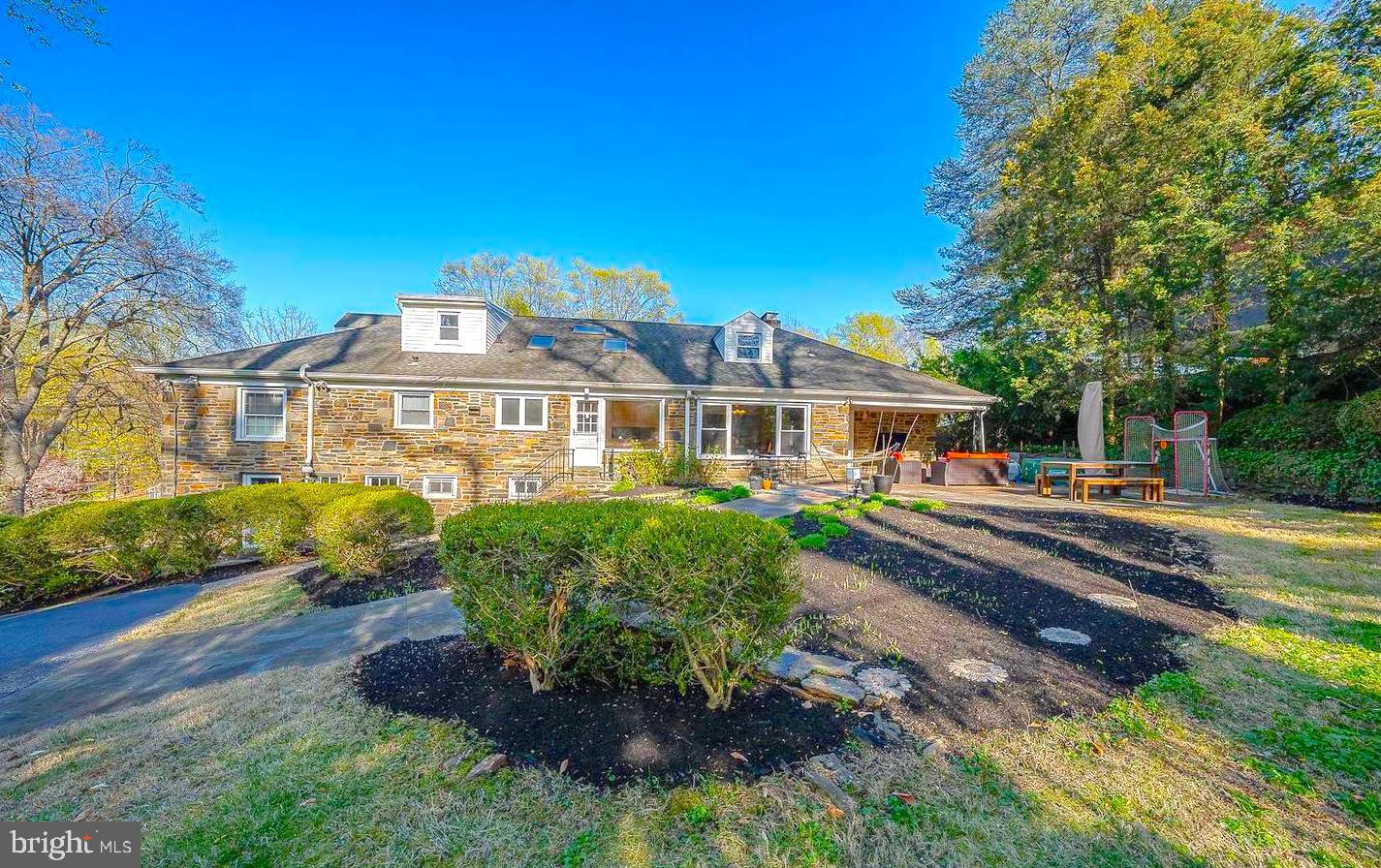 612 Manayunk Road Merion Station, PA 19066 - Photo 48 of 48 a front view of a house with a garden