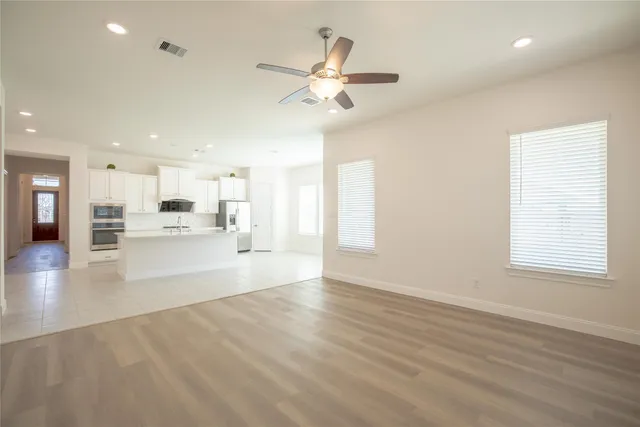 a view of a kitchen with a sink and a window
