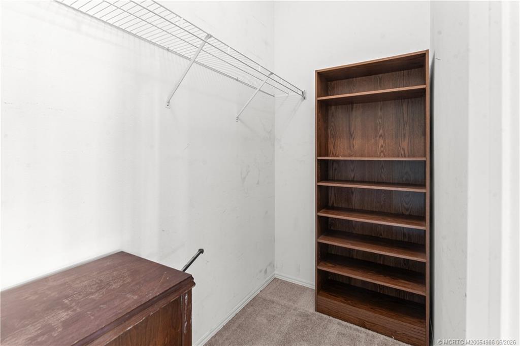 4237 4th Court Lantana, FL 33462 - Photo 25 of 40 a view of walk in closet with empty racks