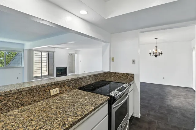 a kitchen with a stove and a sink