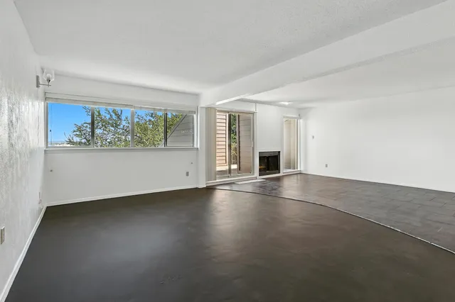 an empty room with a fireplace